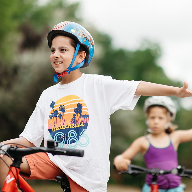 slider 3 boy learning road safety skills at boston summer camp