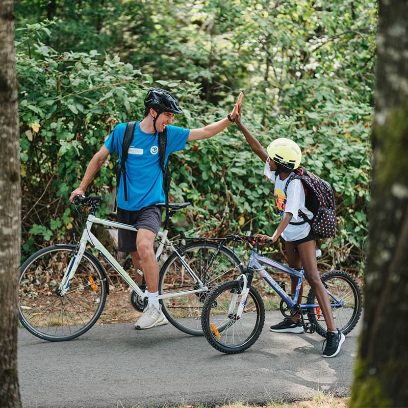 girl with instructor at trail riding summer camp